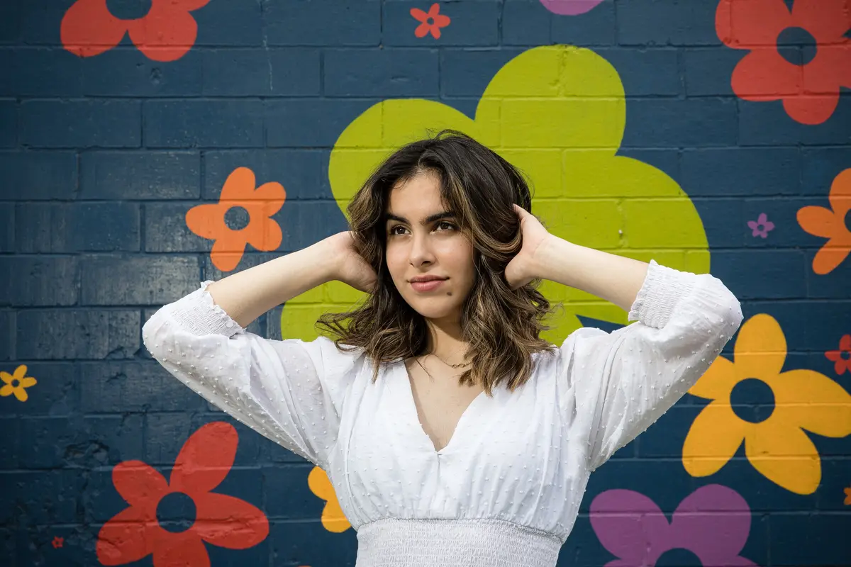 lifestyle portrait at a painted flower mural