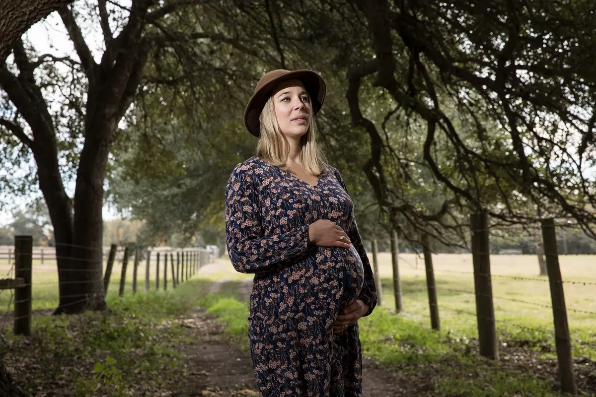 maternity portrait under Texas oak trees