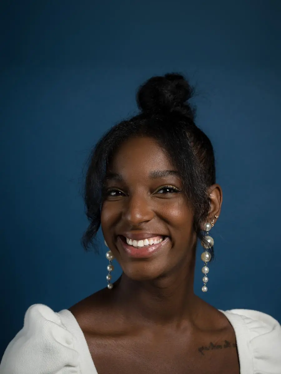 studio portrait on navy with pearl earrings
