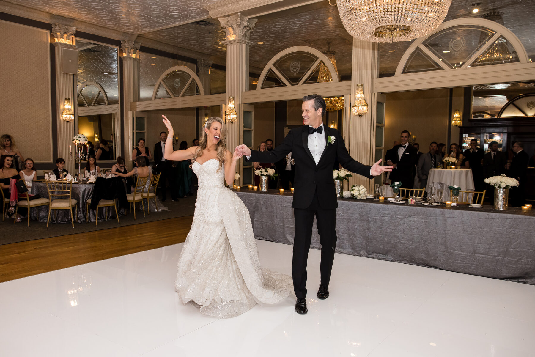 First dance in a chandelier ballroom