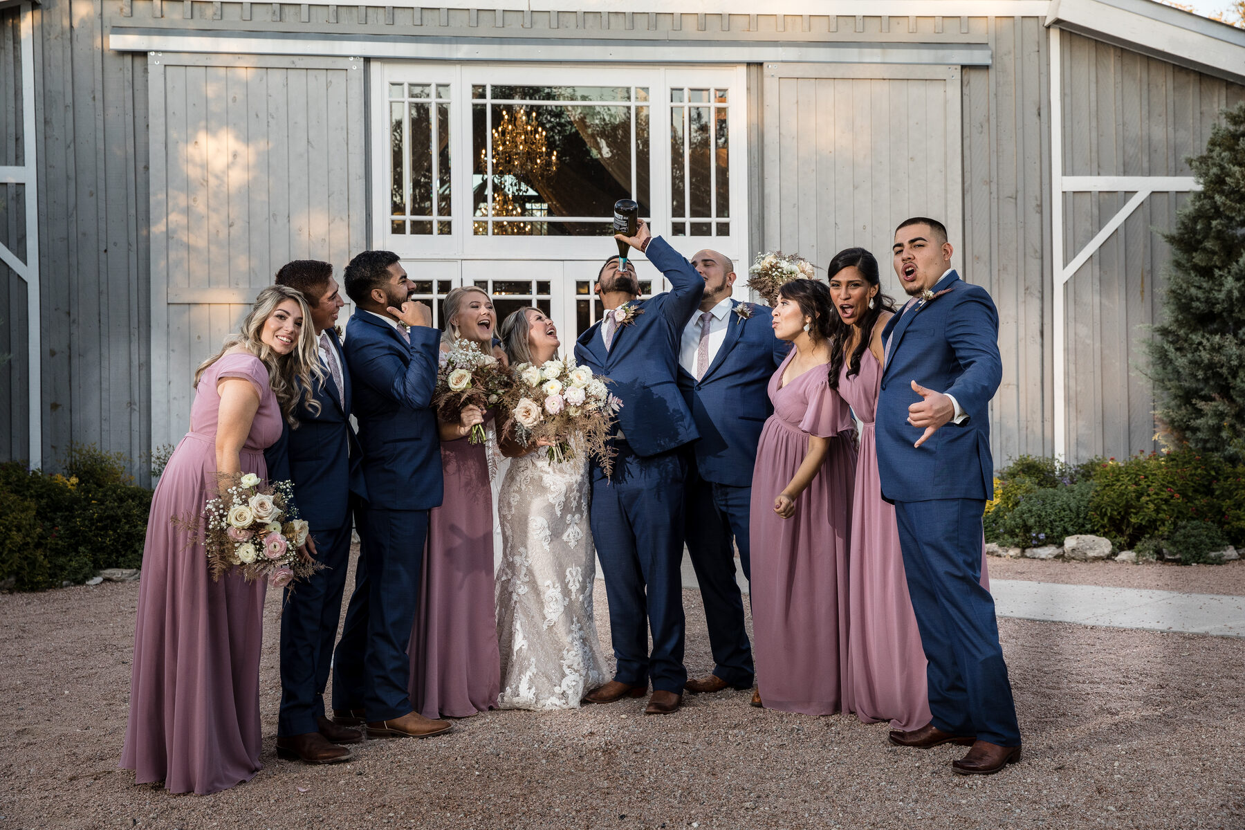 Wedding party cheering with bouquet selfie