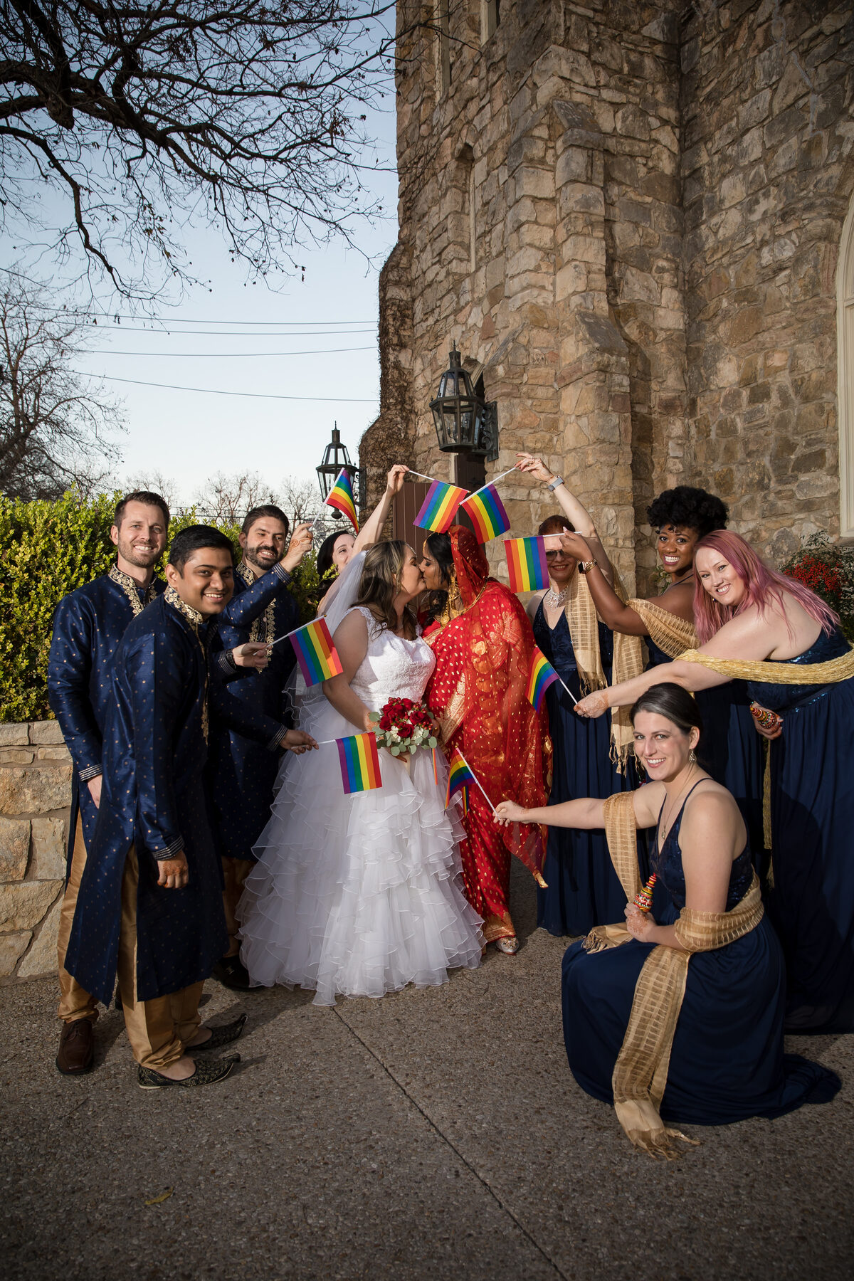 LGBTQ wedding party with pride flags