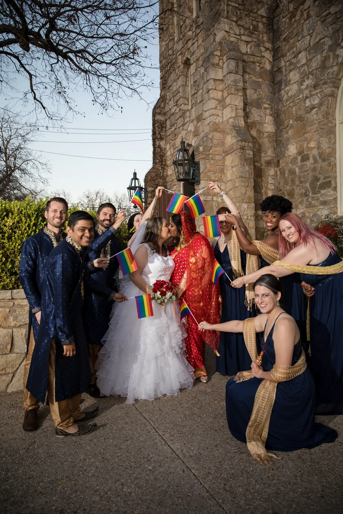 LGBTQ wedding party with pride flags