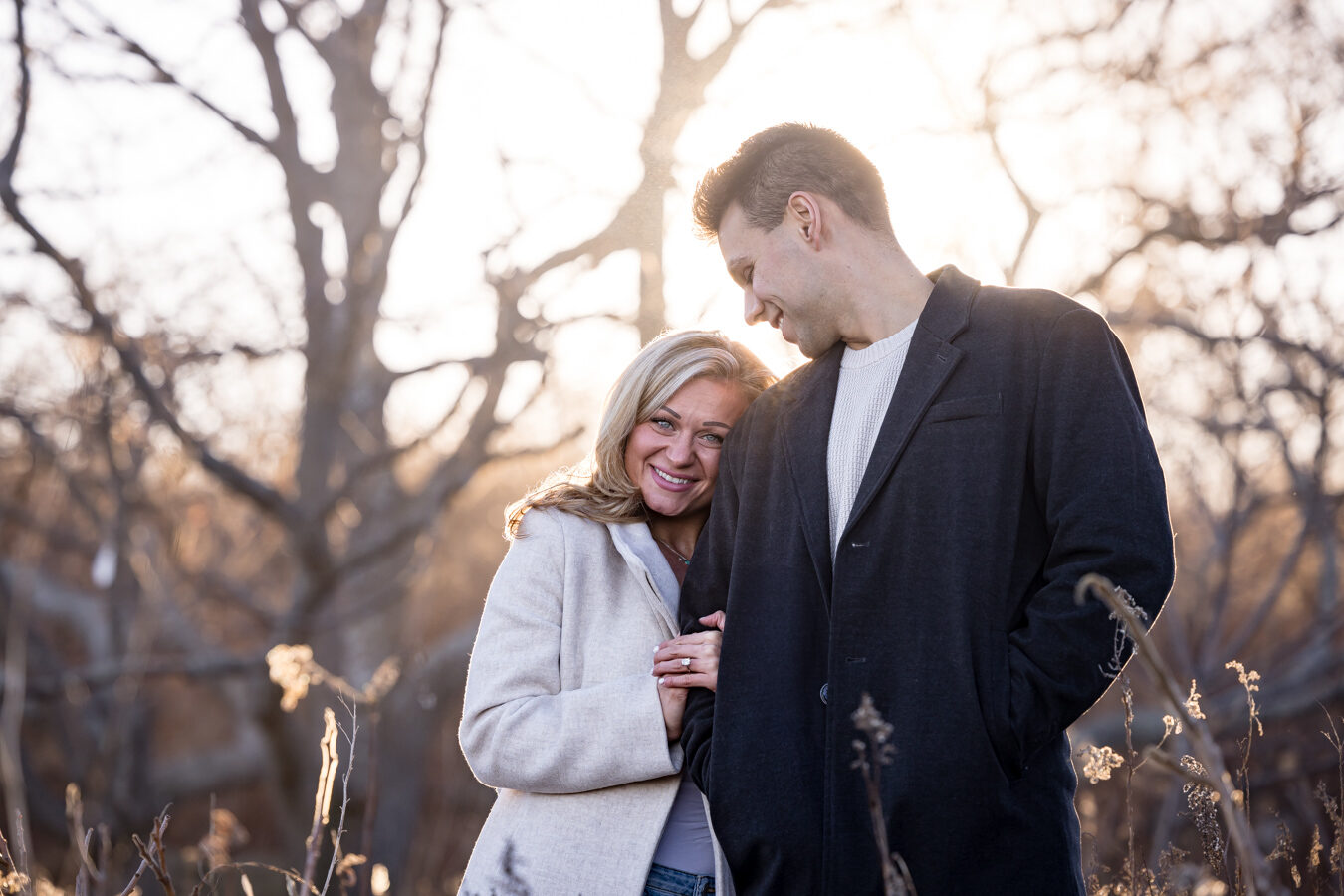 Couple at golden hour in a winter field