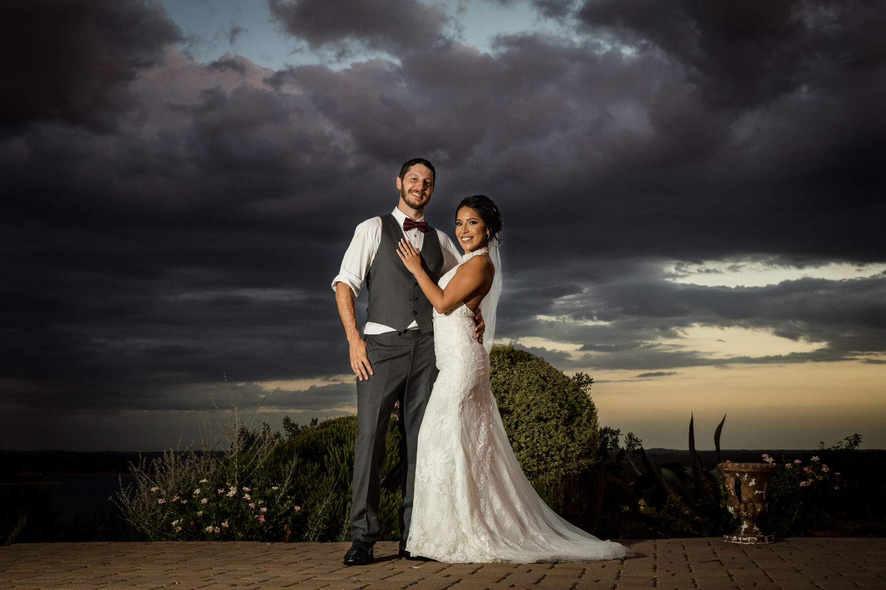 Couple under dramatic stormy Hill Country sky