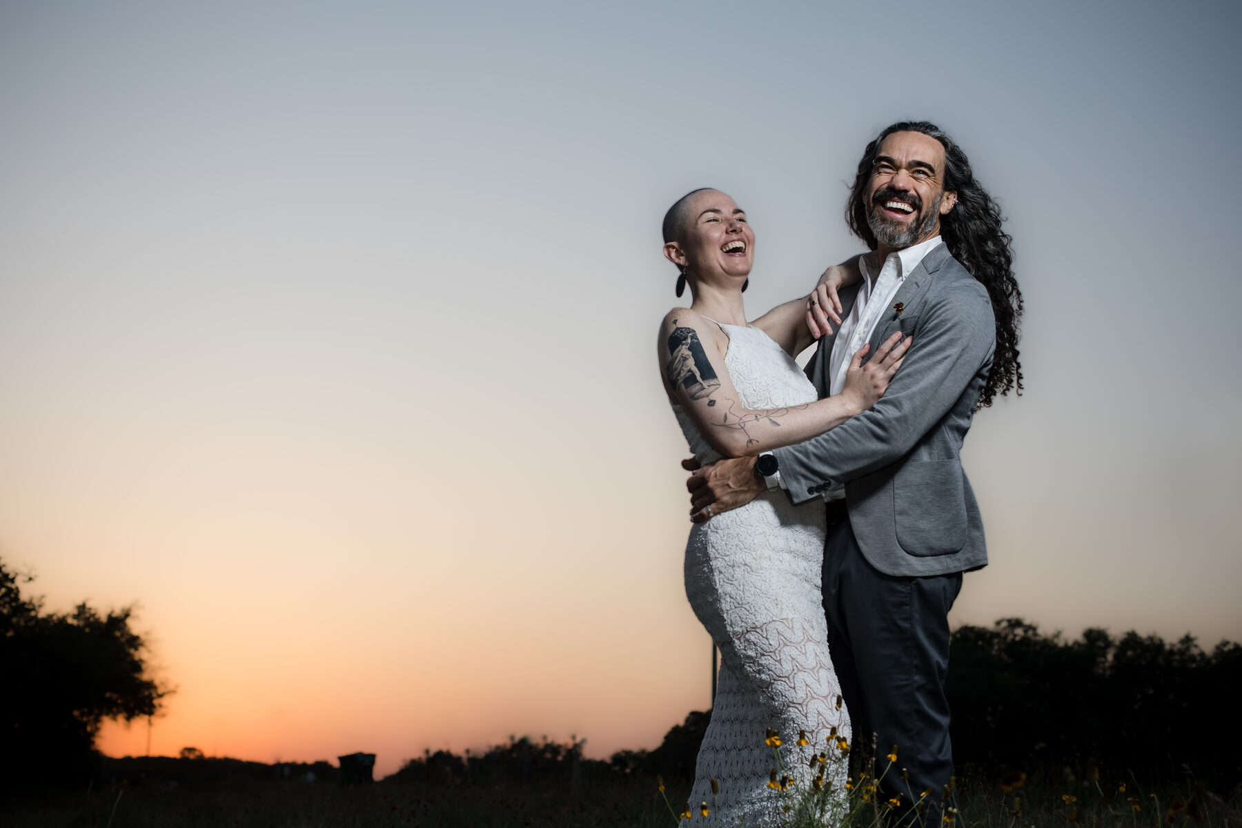 Laughing couple at sunset
