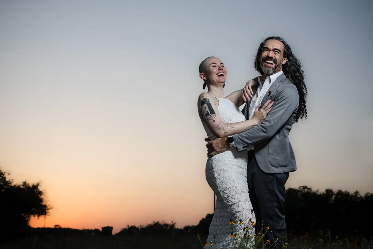 Laughing couple at sunset