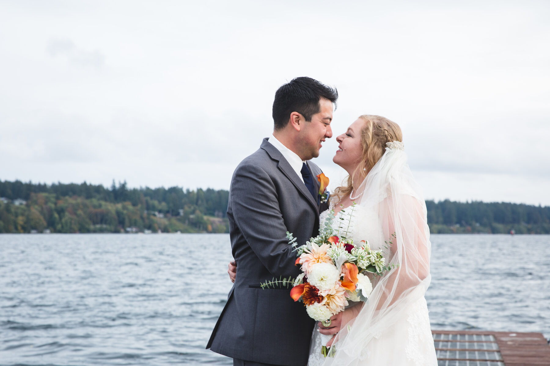 Couple at the lake on their wedding day