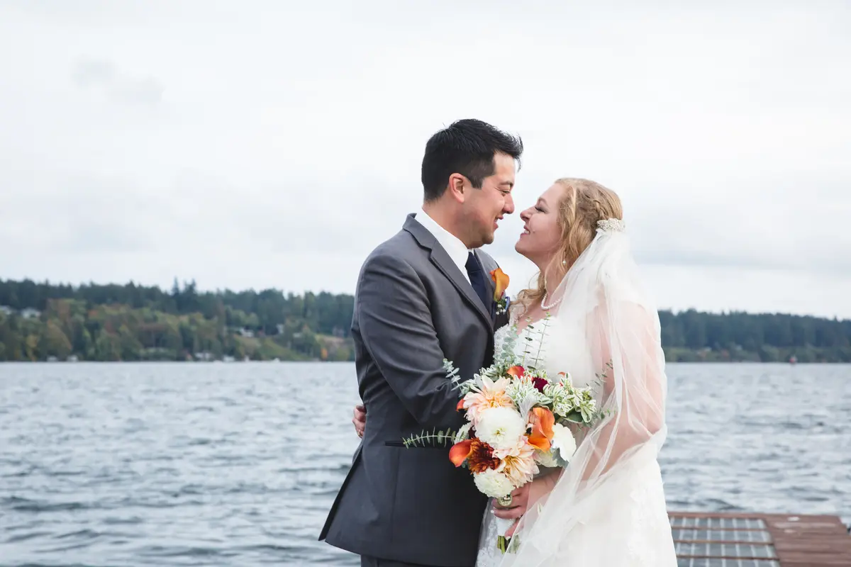 Couple at the lake on their wedding day